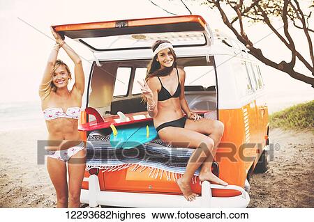 Surfer Girls Beach Lifestyle; Beautiful Surfer Girls Relaxing In The Back Of Classic Vintage Surf Van On The Beach At Sunset View Large Photo Image Stock Photograph - Surfer Girls Beach Lifestyle; Beautiful Surfer Girls Relaxing In The Back Of Classic Vintage Surf Van On The Beach At Sunset. Fotosearch