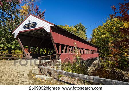 Stock Photograph - Swift River covered bridge on a back country road in autumn, White Mountains National Forest; Conway, New Hampshire, United States of America. Fotosearch