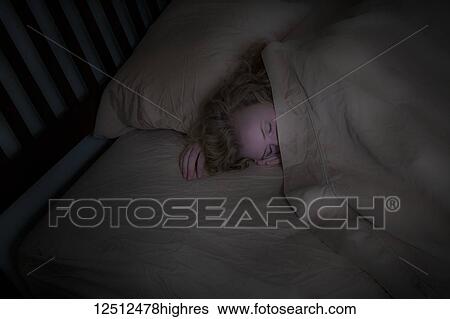 Teenage girl with blond hair lying in her bed; Connecticut, United States of America View Large Photo Image Stock Photograph - Teenage girl with blond hair lying in her bed; Connecticut, United States of America. Fotosearch
