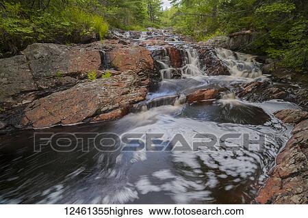 Terraced waterfalls in spring along Kings Brook, near Sleepy Cove; Grand Lake, Nova Scotia, Canada View Large Photo Image Stock Photograph - Terraced waterfalls in spring along Kings Brook, near Sleepy Cove; Grand Lake, Nova Scotia, Canada. Fotosearch