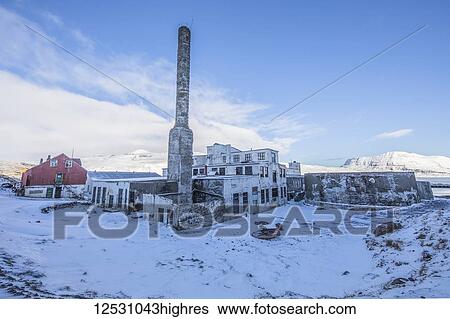 Stock Photograph - The abandoned herring factory in snow; Djupavik, West Fjords, Iceland. Fotosearch