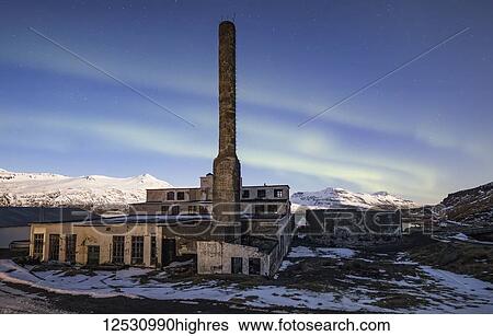 Stock Photograph - The abandoned herring factory with northern lights above it; Djupavik, West Fjords, Iceland. Fotosearch