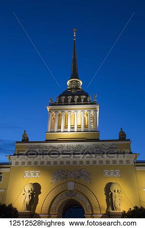 Stock Photograph - The Admiralty Building illuminated with light at dusk; Saint Petersburg, Russia. Fotosearch