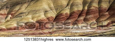The claystone hills are graceful and colourful at John Day Fossil Beds National Monument; Mitchell, Oregon, United States of America View Large Photo Image Stock Photograph - The claystone hills are graceful and colourful at John Day Fossil Beds National Monument; Mitchell, Oregon, United States of America. Fotosearch
