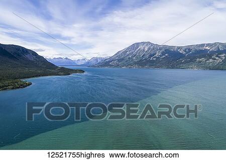 The colour difference of Bennett Lake which the town of Carcross sits along; Carcross, Yukon Territory, Canada View Large Photo Image Stock Photograph - The colour difference of Bennett Lake which the town of Carcross sits along; Carcross, Yukon Territory, Canada. Fotosearch