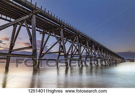Stock Photograph - The disused Steetley Pier was built to serve the former Hartlepool Magnesia Works which has now been demolished; Hartlepool, County Durham, England. Fotosearch