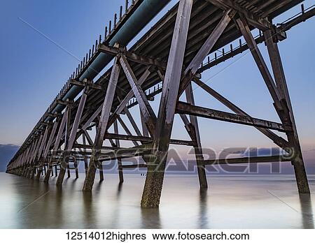 Stock Photograph - The disused Steetley Pier was built to serve the former Hartlepool Magnesia Works which has now been demolished; Hartlepool, County Durham, England. Fotosearch