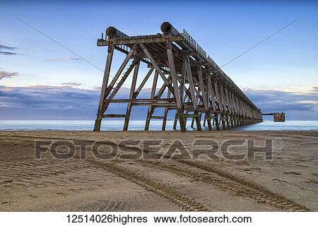 Stock Photograph - The disused Steetley Pier was built to serve the former Hartlepool Magnesia Works which has now been demolished; Hartlepool, County Durham, England. Fotosearch
