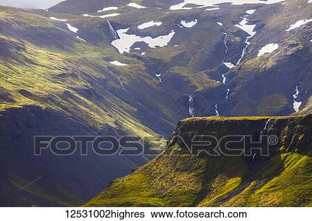 Stock Photograph - The greenery of the Icelandic countryside with waterfalls, Snaefellsness Peninsula; Grundarfjordur, Iceland. Fotosearch