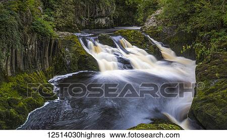 Stock Photograph - The Ingleton Waterfalls Trail is 5 miles long, with a vertical rise of over 500 feet; Ingleton, North Yorkshire, England. Fotosearch