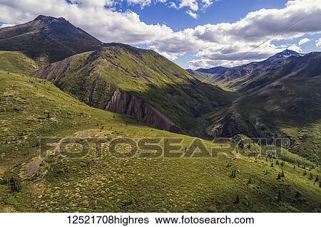 The mountains of the Tombstone Range in northern Yukon, Dempster Highway; Yukon Territory, Canada View Large Photo Image Stock Photograph - The mountains of the Tombstone Range in northern Yukon, Dempster Highway; Yukon Territory, Canada. Fotosearch