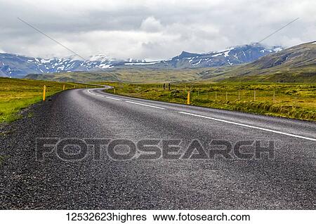 The open highway leads into the mountain landscape in Western Iceland; Iceland View Large Photo Image Stock Photograph - The open highway leads into the mountain landscape in Western Iceland; Iceland. Fotosearch