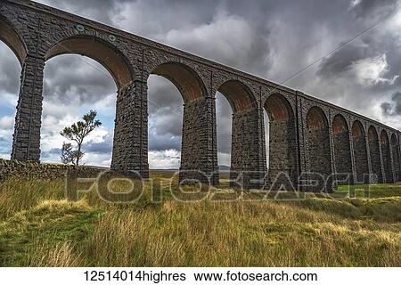 Stock Photograph - The Ribblehead viaduct carries the Settle-Carlisle railway line and was opened in 1875; Ribblehead, North Yorkshire, England. Fotosearch