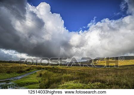 The Ribblehead Viaduct, opened in 1875, is one of the most famous of the many feats of Victorian engineering along the stunning Settle to Carlisle railway line; North Yorkshire, England View Large Photo Image Stock Photograph - The Ribblehead Viaduct, opened in 1875, is one of the most famous of the many feats of Victorian engineering along the stunning Settle to Carlisle railway line; North Yorkshire, England. Fotosearch