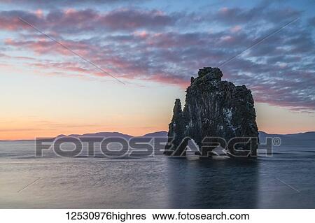Stock Photograph - The rock formation known as Hvitserkur, at sunset, Northern Iceland; Iceland. Fotosearch