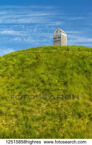 Thufa grassy dome with fish drying house on top is an art installation by Olof Nordal; Reykjavik, Iceland View Large Photo Image Stock Photograph - Thufa grassy dome with fish drying house on top is an art installation by Olof Nordal; Reykjavik, Iceland. Fotosearch
