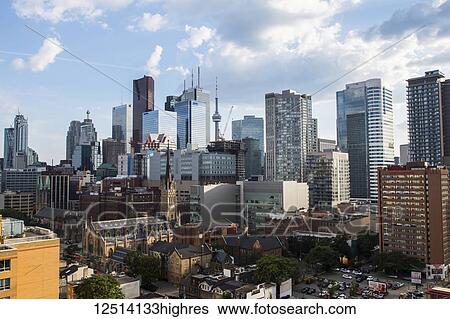 Toronto skyline in the morning under a blue sky with cloud; Toronto, Ontario, Canada View Large Photo Image Stock Photograph - Toronto skyline in the morning under a blue sky with cloud; Toronto, Ontario, Canada. Fotosearch