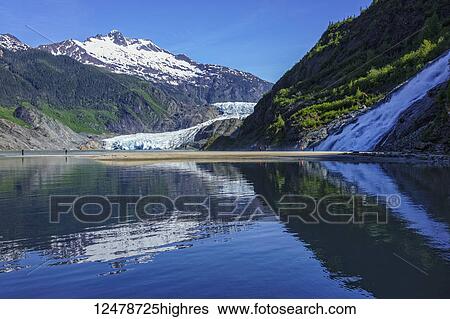 Tourists viewing Mendenhall Glacier and Nugget Falls in Mendenhall Park Recreation Area, near Juneau; Alaska, United States of America View Large Photo Image Stock Photograph - Tourists viewing Mendenhall Glacier and Nugget Falls in Mendenhall Park Recreation Area, near Juneau; Alaska, United States of America. Fotosearch