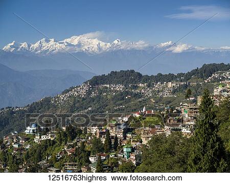 Town on a mountainside with the rugged, snow-capped peaks of the Himalayas in the distance; Darjeeling, West Bengal, India View Large Photo Image Stock Photograph - Town on a mountainside with the rugged, snow-capped peaks of the Himalayas in the distance; Darjeeling, West Bengal, India. Fotosearch
