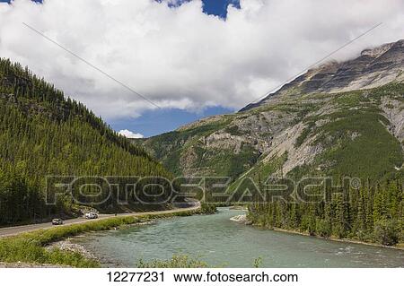 Traffic on the Alaska Highway running along the Toad River, Muncho Lake Provincial Park, British Columbia, Canada, Summer View Large Photo Image Stock Image - Traffic on the Alaska Highway running along the Toad River, Muncho Lake Provincial Park, British Columbia, Canada, Summer. Fotosearch