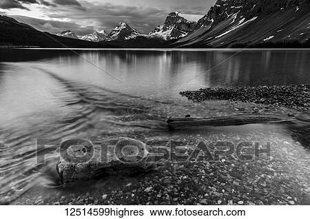 Tranquil, clear water along the shoreline of a lake in Banff National Park; Alberta, Canada View Large Photo Image Stock Photograph - Tranquil, clear water along the shoreline of a lake in Banff National Park; Alberta, Canada. Fotosearch