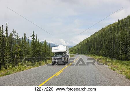 Truck and RV camper drive down the Alaska Highway, west of Fort Nelson, British Columbia, Canada, Summer View Large Photo Image Stock Image - Truck and RV camper drive down the Alaska Highway, west of Fort Nelson, British Columbia, Canada, Summer. Fotosearch