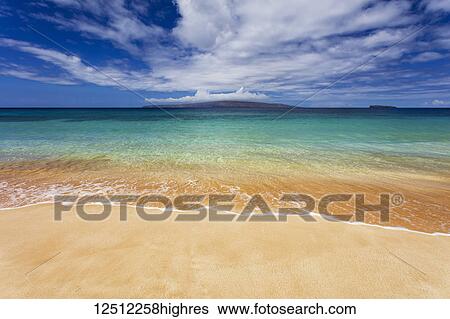 Stock Photograph - Turquoise ocean water and golden sand on Big Beach, Makena State Park; Makena, Maui, United States of America. Fotosearch