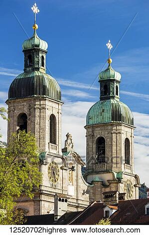 Two stone church steeples with gold crosses and blue sky; Innsbruck, Tyrol, Austria View Large Photo Image Stock Photograph - Two stone church steeples with gold crosses and blue sky; Innsbruck, Tyrol, Austria. Fotosearch