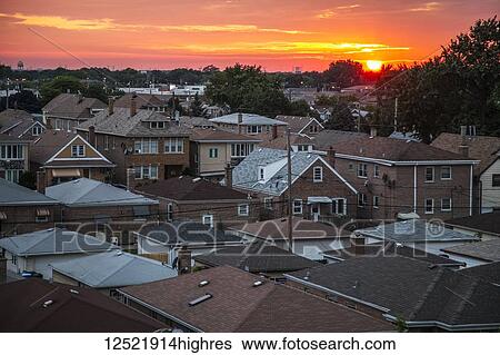 Stock Photograph - Urban neighborhood Archer Heights in Chicago at sunset; Chicago, Illinois, United States of America. Fotosearch