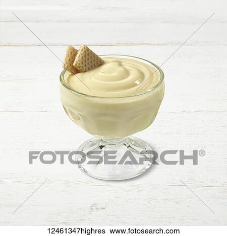 Vanilla pudding in a glass cup with vanilla wafers as a garnish View Large Photo Image Stock Photograph - Vanilla pudding in a glass cup with vanilla wafers as a garnish. Fotosearch