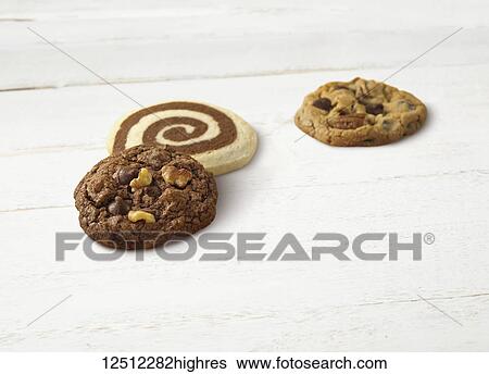 Variety of holiday cookies on a wooden white surface View Large Photo Image Stock Photograph - Variety of holiday cookies on a wooden white surface. Fotosearch