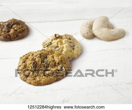 Variety of holiday cookies on a wooden white surface View Large Photo Image Stock Photograph - Variety of holiday cookies on a wooden white surface. Fotosearch