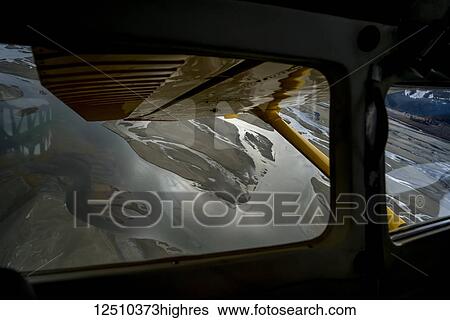 Stock Photograph - View from an airplane window down to the water of Lynn Canal; Haines, Alaska, United States of America. Fotosearch