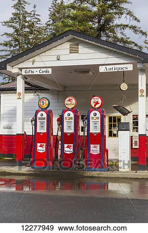 Stock Photo - View of a fueling station with three vintage fuel pumps in Gustavus, Southeast Alaska, Summer.. Fotosearch