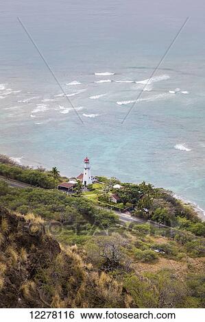 View of Diamond Head Lighthouse with waves breaking in the shallow water in background; Honolulu, Oahu, Hawaii, United States of America View Large Photo Image Stock Photograph - View of Diamond Head Lighthouse with waves breaking in the shallow water in background; Honolulu, Oahu, Hawaii, United States of America. Fotosearch