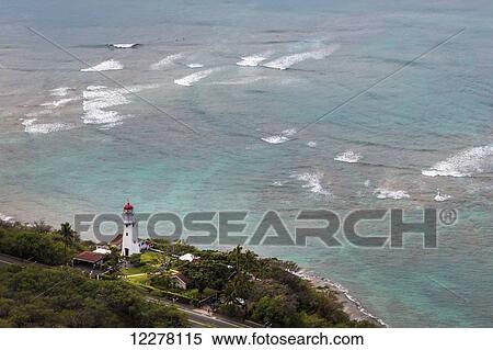 View of Diamond Head Lighthouse with waves breaking in the shallow water in background; Honolulu, Oahu, Hawaii, United States of America View Large Photo Image Stock Photography - View of Diamond Head Lighthouse with waves breaking in the shallow water in background; Honolulu, Oahu, Hawaii, United States of America. Fotosearch
