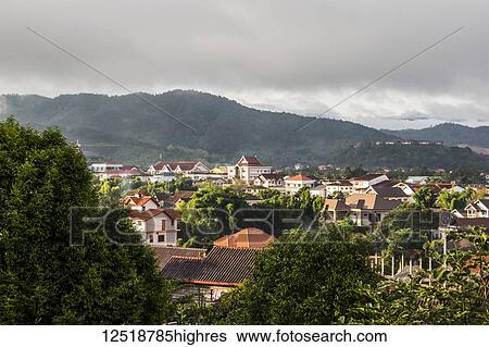 Stock Photograph - view of Phonsavan, the provincial capital of Xiangkhouang Province, with forested hills; Phonsavan, Xiangkhouang, Laos. Fotosearch