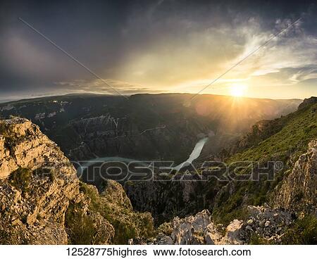 Stock Photograph - View of the Sulak canyon and the river at the sunset; Dubki, Dagestan Republic, Russia. Fotosearch