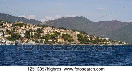 Stock Photograph - View of the town of Herceg Novi along the coast of Monte; Herceg Novi, Monte. Fotosearch