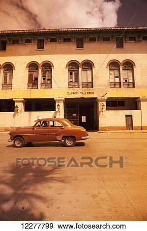 Vintage car on a street; Havana, Cuba View Large Photo Image Stock Photo - Vintage car on a street; Havana, Cuba. Fotosearch