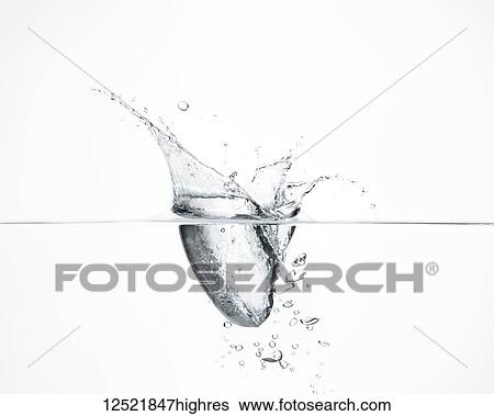 Stock Photograph - Water droplet splashing into water. Fotosearch