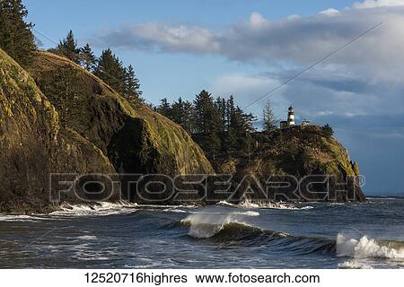 Stock Photograph - Waves break at Cape Disappointment at the mouth of the Columbia River; Ilwaco, Washington, United States of America. Fotosearch