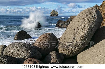 Stock Photograph - Waves crash on the rocks along the South coast of Iceland; Iceland. Fotosearch