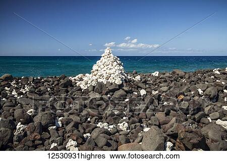 Stock Photograph - White coral marker (ahu), Kiholu Bay, South Kohala Coast; Island of Hawaii, Hawaii, United States of America. Fotosearch