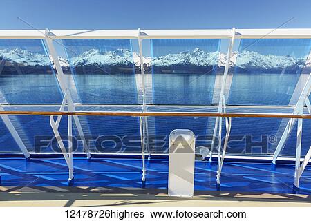 Stock Photograph - Wind breaks on cruise ship entering College Fjord in Glacier Bay National Park and Preserve; Alaska, United States of America. Fotosearch