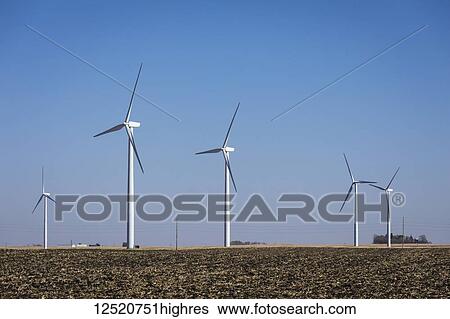 Stock Photograph - Wind turbines on tilled corn fields near Buffalo Center; Iowa, United States of America. Fotosearch
