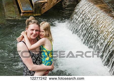 Woman and daughter in Liard Hot Springs, British Columbia, Canada, summer View Large Photo Image Stock Image - Woman and daughter in Liard Hot Springs, British Columbia, Canada, summer. Fotosearch