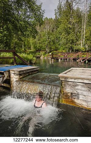 Woman soaking in Liard Hot Springs, British Columbia, Canada, summer View Large Photo Image Picture - Woman soaking in Liard Hot Springs, British Columbia, Canada, summer. Fotosearch