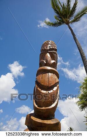 Stock Photograph - Wooden tiki at Napili Bay; Napili, Maui, Hawaii, United States of America. Fotosearch