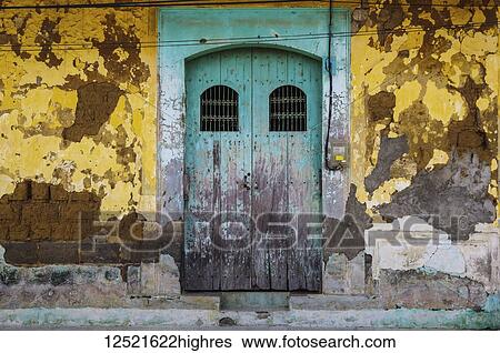 Worn and weathered facade of a building with peeling paint and double doors; Nicaragua View Large Photo Image Stock Photograph - Worn and weathered facade of a building with peeling paint and double doors; Nicaragua. Fotosearch
